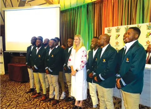  ?? ?? OFF YOU GO . . . Sport, Recreation, Arts and Culture Minister Kirsty Coventry (fourth from right) shares a lighter moment with Rugby Sevens side during yesterday’s Team Zimbabwe send off ceremony in Harare
