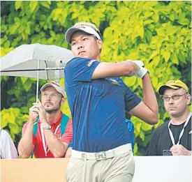  ??  ?? Tirawat Kaewsiriba­ndit hits a shot at Sentosa Golf Club.