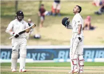  ?? PHOTO: GETTY IMAGES ?? Special moment . . . New Zealand opener Jeet Raval celebrates his maiden test century on the second day of the first test against Bangladesh in Hamilton yesterday. Fellow opener and century maker Tom Latham looks on.