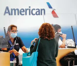  ?? Vernon Bryant / Dallas Morning News ?? All American Airlines employees in the U.S. must show proof that they are fully vaccinated by Nov. 24 or face terminatio­n, the carrier told employees in an email this week.