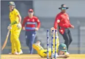  ??  ?? Australian batswoman Beth Mooney runs out playing against England during the Women's T20I Tri-series cricket match at Brabourne stadium in Mumbai on Friday.