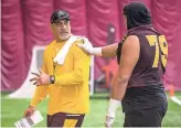  ??  ?? Offensive analyst Kevin Mawae works with Ralph Frias during practice on Tuesday at the Verde Dickey Dome in Tempe. SEAN LOGAN/THE REPUBLIC
