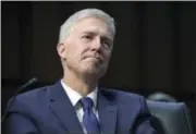  ?? SUSAN WALSH- THE ASSOCIATED PRESS ?? In this March 20 photo, Supreme Court Justice nominee Neil Gorsuch listens to opening statements on Capitol Hill in Washington, during his confirmati­on hearing before the Senate Judiciary Committee.