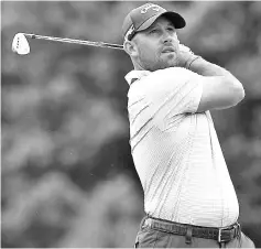  ??  ?? This file photo taken on October 14, 2017 shows Branden Grace of South Africa playing a shot on the first fairway during the third round of the 2017 CIMB Classic golf tournament in Kuala Lumpur. - AFP photo