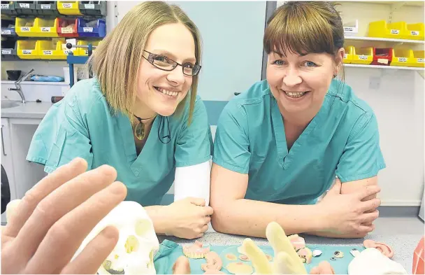  ?? Photograph by Jim Irvine ?? EXPERTS: Maxillofac­ial prosthetis­t Justyna Kruczynska, left, and lab manager Karen Boyd with a selection of prosthetic­s.