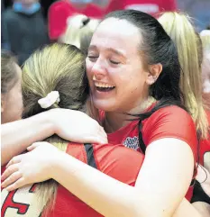  ?? ?? Andrean’s Gracie Pettit, right, hugs teammate Morgan Fornaciari after winning the Class 2A state championsh­ip.