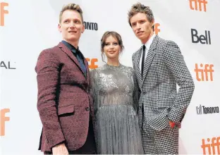  ?? MARIO ANZUONI/REUTERS ?? Director Tom Harper, Eddie Redmayne and Felicity Jones arrive at the Canadian premiere of “The Aeronauts” at the Toronto Internatio­nal Film Festival (TIFF) in Toronto, Sunday.