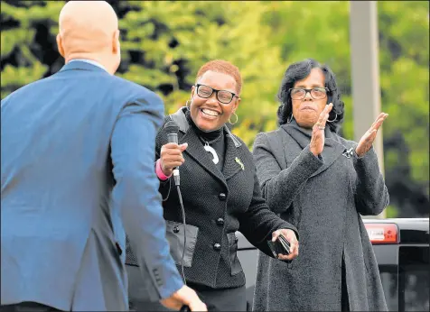  ?? KYLE TELECHAN/POST-TRIBUNE ?? Gary Mayor Karen Freeman-Wilson, center, and state Sen. Earline Rogers, D-Gary, introduce U.S. Sen. Cory Booker, D-N.J., during a rally in front of the Genesis Convention Center in Gary. Freeman-Wilson has sought advice from Booker.