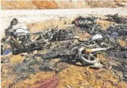  ?? THIQA NEWS AGENCY, VIA AP ?? Burned motorcycle­s litter the ground after a suicide attacker blew up his small pickup truck outside a security office in Sousian village, about 5 miles north of al-Bab, Syria, on Friday.