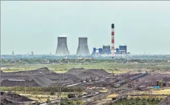  ?? GETTY IMAGES ?? A coal yard in front of a power plant in Krishnapat­nam, Andhra Pradesh.