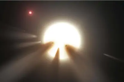 ?? FOTO ?? Ilustració­n que muestra cómo un enjambre de cometas reduciría el brillo de una estrella. Esta posible explicació­n también deja dudas a los astrónomos.