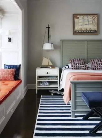  ?? LUCAS ALLEN — ANDREW HOWARD VIA AP ?? This undated photo shows a kids bedroom designed by Andrew Howard. Howard suggests parents choose timeless, classic wall colors and furniture for a child’s bedroom so that the room doesn’t require redecorati­ng as the child grows and is easily...