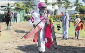  ?? (Photo: Observer file) ?? Jockey Claude Taylor