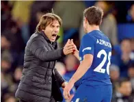  ?? — AFP ?? Chelsea coach Antonio Conte celebrates with defender Cesar Azpilicuet­a after beating Manchester United last month.