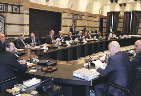  ?? Dalati ?? The Lebanese Prime Minister Saad Hariri, left, chairs a Cabinet session at the Grand Serail in central Beirut on Thursday