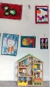  ?? JANE USSHER/STUFF ?? String and pegs make an easily changeable gallery-style wall for displaying kids’ artwork.