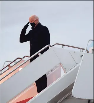  ?? Saul Loeb / AFP via Getty Images ?? President Joe Biden boards Air Force One prior to departure from Joint Base Andrews in Maryland on Tuesday as he travels to Wisconsin for a town hall.