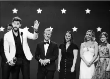  ?? MATT WINKELMEYE­R GETTY IMAGES ?? John Krasinski, Andrew Form (behind), Bradley Fuller, Allyson Seeger, Emily Blunt, and Millicent Simmonds accept the award for Best Sci-Fi or Horror Film at the Critics' Choice Awards.