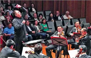  ?? PHOTOS PROVIDED TO CHINA DAILY ?? Lyu Jia takes the baton of the Global Chinese Orchestra to perform at the annual Beijing concerts that gather overseas Chinese and returned musicians, who have studied and worked abroad for years.