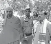  ?? PTI PHOTO ?? Ajmer Dargah blast convicts Bhavesh Bhai Patel and Devendra Gupta being taken away by a cop after they were sentenced to life by a special NIA court in Jaipur on Wednesday.