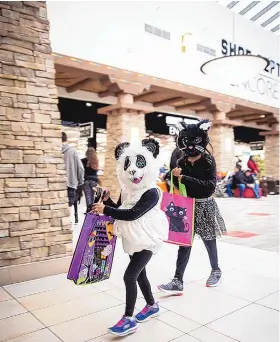  ?? COURTESY OF SANTA FE PLACE MALL ?? The 80 shops at the Santa Fe Place Mall will be giving out ‘trick or treat’ candy from 3-6 p.m., with festivitie­s including face-painting, animal-balloon making and a pumpkincar­ving contest that starts at 2 p.m.
ON THE COVER: Local residents Xochitl Ehrl, at left, and Josephine Tincher are dressed for El Día de Los Muertos Community Celebratio­n at Teatro Paraguas.