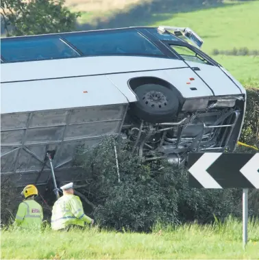  ?? Photograph: John Linton/PA Wire ?? Emergency services at the scene of yesterday’s crash