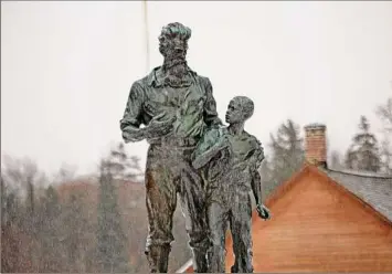  ?? Gwendolyn Craig / Adirondack Explorer ?? A statue of abolitioni­st John Brown and an African-American child at John Brown Farm was commission­ed through private donations and the John Brown Associatio­n.