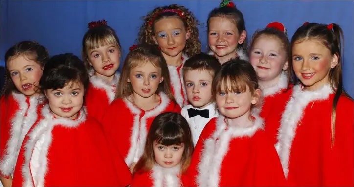  ??  ?? December 2005 - Out numbered......Ronan O’Hanlon Coyne pictured with Lindsay and Karen Greene and Niamh Lynch (Front) and (Back L-R) Aoife O’Shaughness­y, Kayla Greene, Chloe Connor, Emily Mulpeter, Sinead Rice, Jessica Robinson and Sarah Harlin taking part in the Mary Simpson Stage School, Christmas Concert held in the Town Hall.