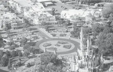  ?? EVE EDELHEIT/THE NEW YORK TIMES ?? Walt Disney World’s Magic Kingdom, the world’s No. 1 theme park by attendance, will reopen on a limited basis on July 11.