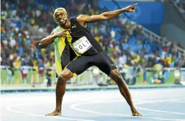  ?? REUTERS ?? RECORD HIT Bolt makes his signature “To the World” pose after winning the 100-meter race in the Olympic Games.