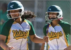  ?? VINCENT OSUNA PHOTO ?? Holtvillle High’s Emily Zarate (left) and Amaya Irungaray smile after they both score from a run during their home CIF-San Diego Section Div. V play-in game against Lincoln High of San Diego on Tuesday in Holtville.