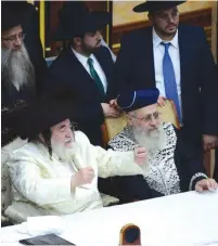  ?? (Shuki Lerrer) ?? THE GRAND RABBI of the Vizhnitz Hassidic dynasty, in his white holiday frock coat, hosts Sephardi Chief Rabbi Yitzhak Yosef on Monday night at the ‘Simchat Beit Hashoeva’ celebratio­n in the Vizhnitz World Center in Bnei Brak.