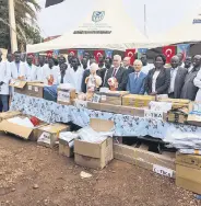  ?? ?? Turkish officials pose with South Sudanese students during an aid ceremony in Malakal, South Sudan, March 27, 2024.