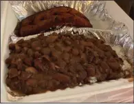  ?? (Arkansas Democrat-Gazette/Eric E. Harrison) ?? Red Beans and Rice with andouille sausage now comes in a to-go container from The Faded Rose.