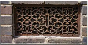  ??  ?? Ornate iron vent on the outside of the church