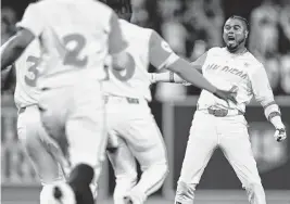  ?? ORLANDO RAMIREZ USA TODAY NETWORK ?? Padres designated hitter Luis Arraez celebrates after hitting a walk-off single against the Dodgers on Friday in San Diego.