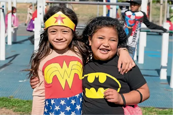  ?? PHOTO: PHIL WINDLEY ?? Hannah Miracle Siamomu, left, and Oceanah Pule prove superheroe­s can live in harmony at Porirua’s Holy Family School on April 14. The school grounds were full of colour as the pupils came dressed as their favourite superhero, and they later welcomed...
