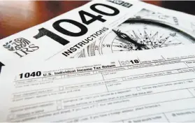  ?? Keith Srakocic / Associated Press ?? A new, improved calculator from the IRS should it make it much easier to get the right amount of federal tax withheld from your paycheck.