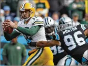  ?? STREETER LECKA / GETTY IMAGES ?? In his return from a broken collarbone, Packers QB Aaron Rodgers passed for 290 yards and 3 TDs but threw 3 INTs in a loss to the Panthers.