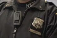  ??  ?? In this Dec. 3, 2014 file photo, New York Police Department officer Joshua Jones wears a VieVu body camera on his chest during a news conference in New York.