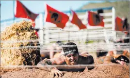  ??  ?? Spartan Race Inc. An athlete competes in a recent Spartan Race. This year the Laughlin Weekend Spartan Race will feature a Spartan Sprint obstacle course for adaptive athletes.