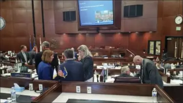 ?? MICHELLE RINDELS — ASSOCIATED PRESS FILE PHOTO ?? Republican lawmakers huddle Oct. 11, 2016 as they discuss a bill that would authorize public funds for an NFL stadium and convention center expansion in Las Vegas during a special legislativ­e session in Carson City, Nev. State lawmakers around the...