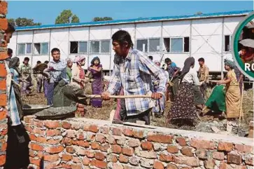  ?? REUTERS PIC ?? People making preparatio­ns for the repatriati­on of the Rohingya, outside Maungdaw, Rakhine State, Myanmar, on Wednesday.