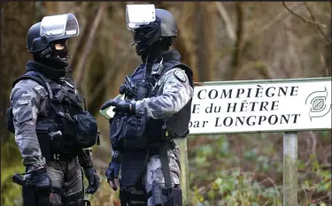  ??  ?? Manhunt: Police officers near the town of Villers-Cotterets yesterday