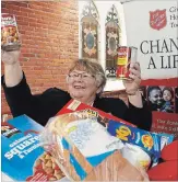  ?? CLIFFORD SKARSTEDT EXAMINER ?? Salvation Army Major Kathie Sharp gets prepared for Monday’s return of the Hope For All Seasons campaign on Tuesday.