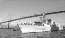  ?? TIM KROCHAK • THE CHRONICLE HERALD ?? HMCS Toronto passes beneath the Macdonald Bridge as it arrives in Halifax on Wednesday.