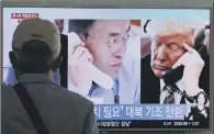  ??  ?? NEWS UPDATE: A man watches a television screen showing US President Donald Trump, right, and South Korean President Moon Jae-in.