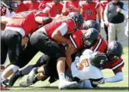  ?? PHOTO PROVIDED BY MICK NEAL/ RPI ATHLETICS ?? A host of RPI players get in for a tackle during a home win against William Paterson on Sept. 2. The Engineers will try to improve to 4- 0this weekend.