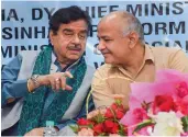  ?? — PTI ?? BJP leader Shatrughan Sinha talks with Delhi deputy chief minister Manish Sisodia during a conference on skill developmen­t in East Delhi on Friday.