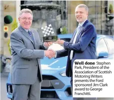  ??  ?? Well done Stephen Park, President of the Associatio­n of Scottish Motoring Writers presents the Ford sponsored Jim Clark award to George Franchitti.